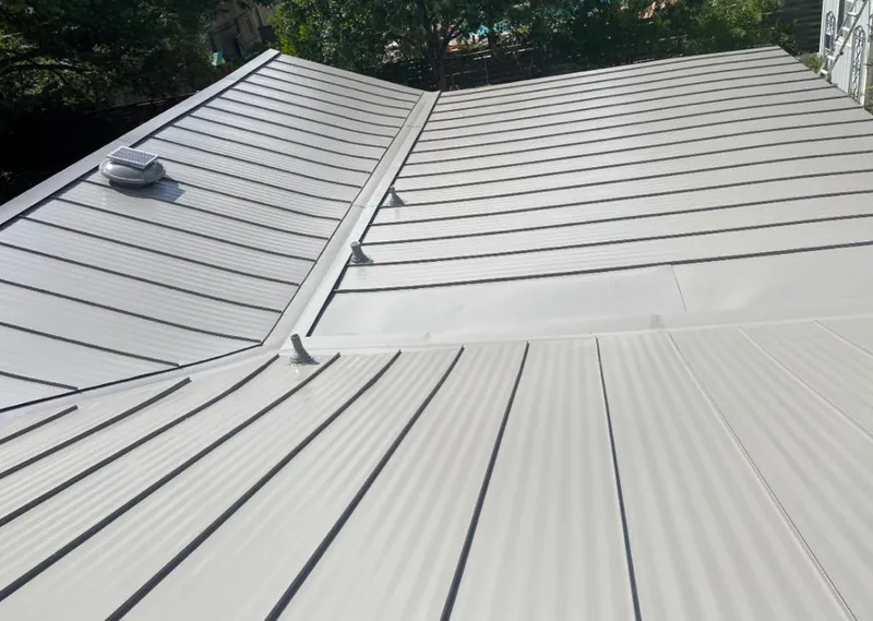 Solar attic fan installed on a metal roof for Roof Ventilation in Poughkeepsie